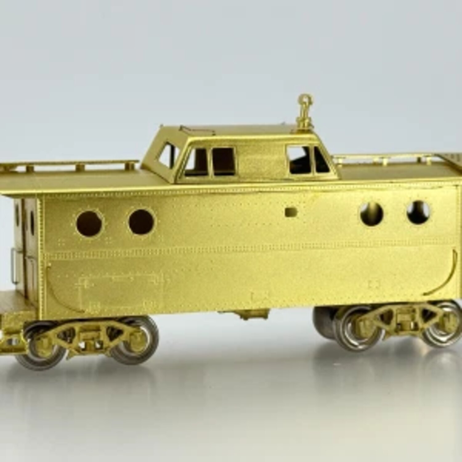 Unpainted brass caboose model