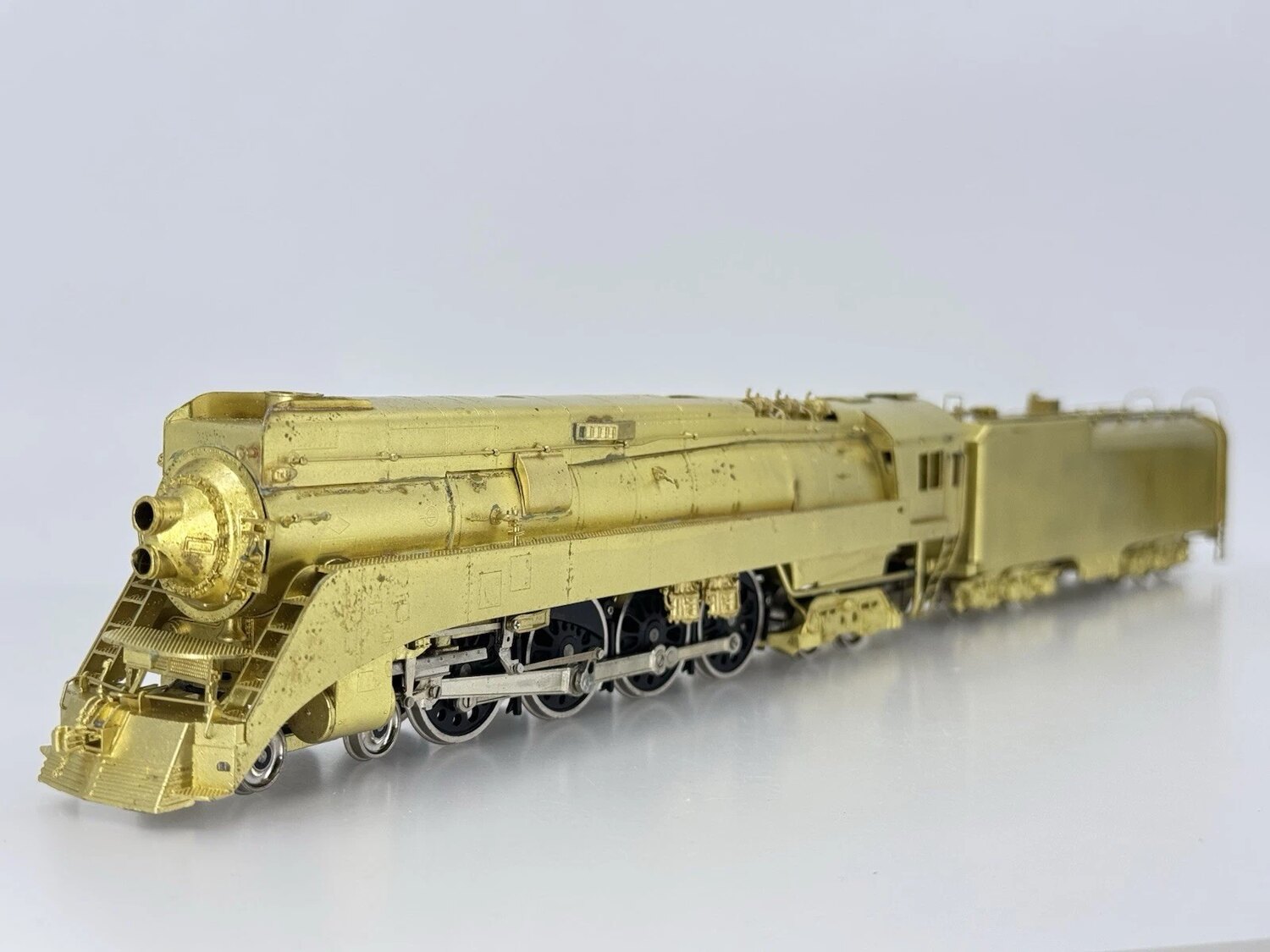 Unpainted brass streamlined steam locomotive