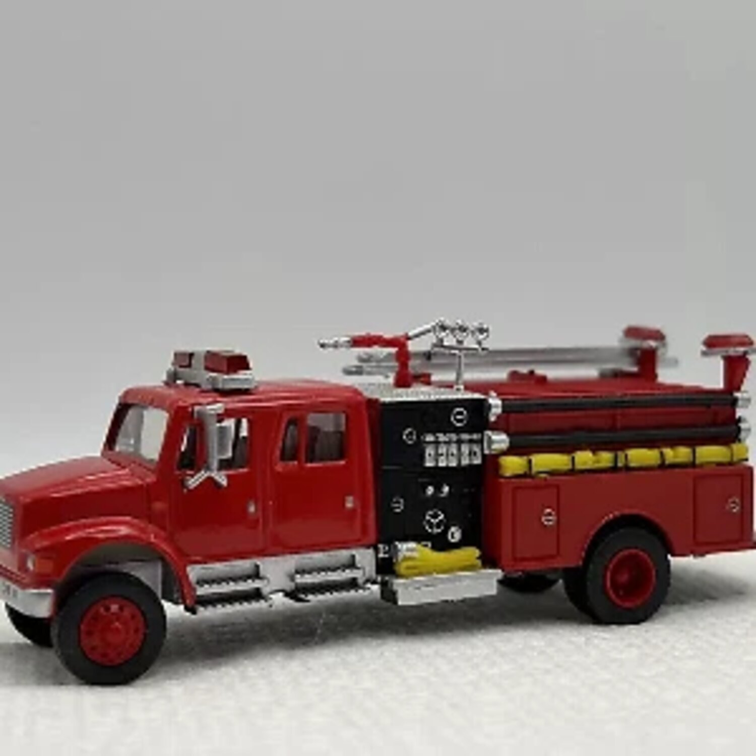 Red fire truck model with ladder detail